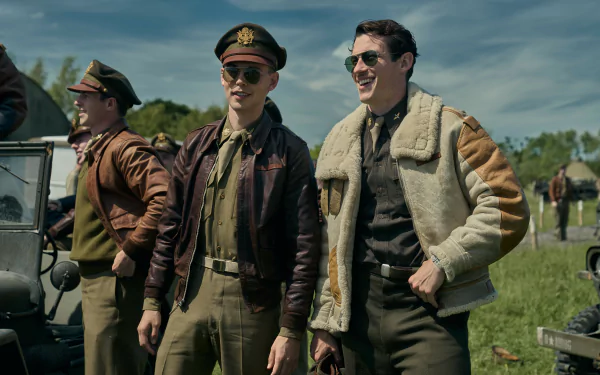 HD wallpaper of actors in military costumes portraying characters in the 'Masters of the Air' TV show, posing on a sunny field with vintage vehicles in the background.