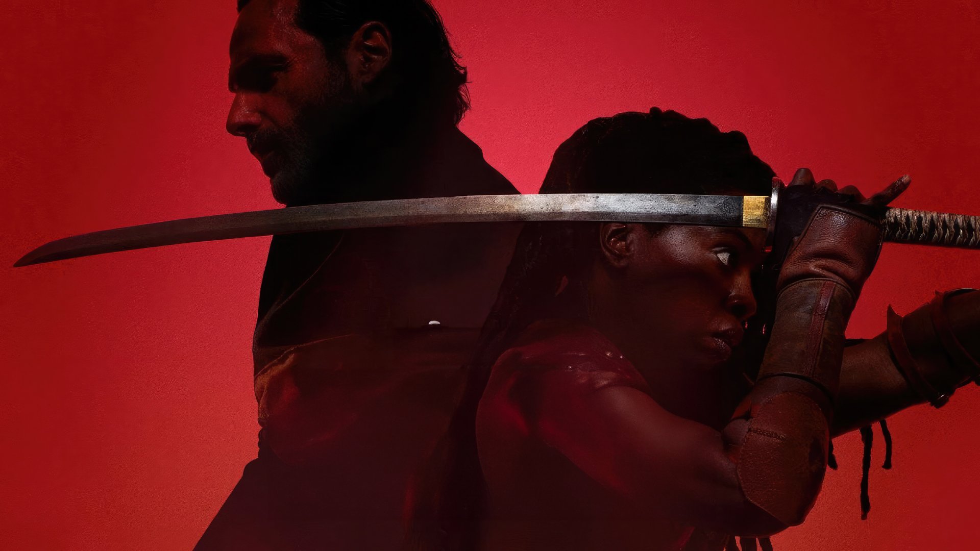 HD desktop wallpaper featuring two characters from The Walking Dead: The Ones Who Live with a dramatic red backdrop, one character holding a sword ready for action.