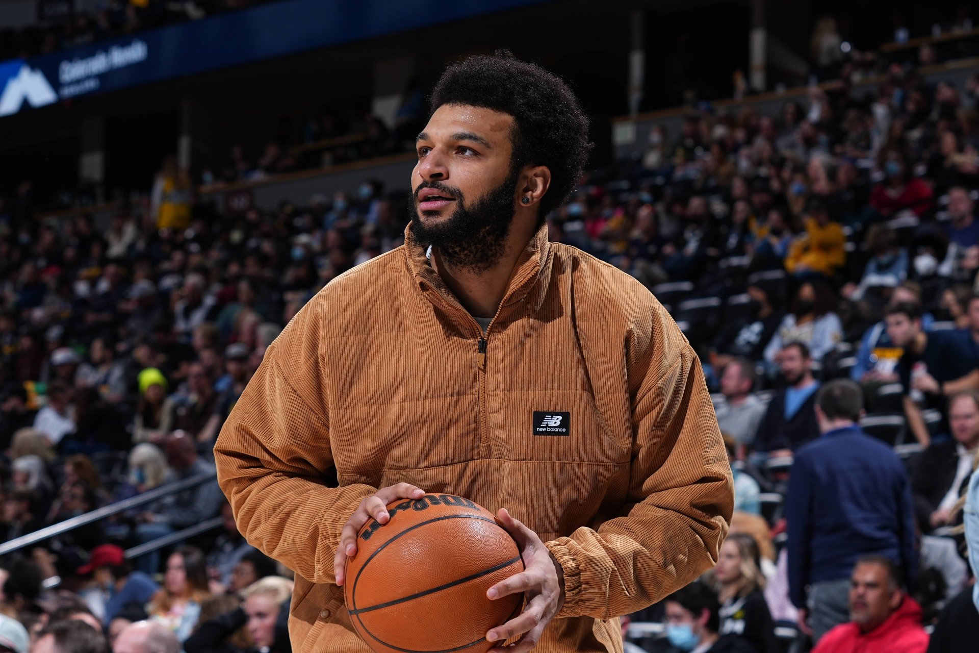 HD desktop wallpaper featuring NBA player Jamal Murray in a corduroy jacket holding a basketball against a crowded arena backdrop.