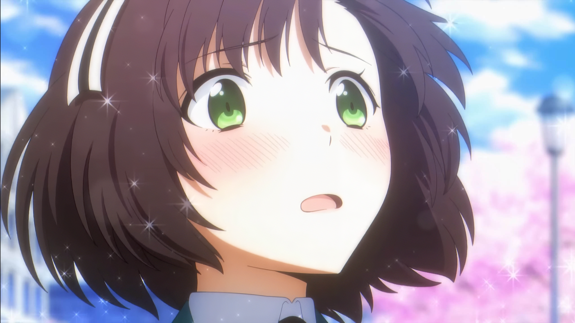 HD wallpaper featuring a close-up of an anime character from The Irregular at Magic High School with sparkling eyes and a blurred floral background.