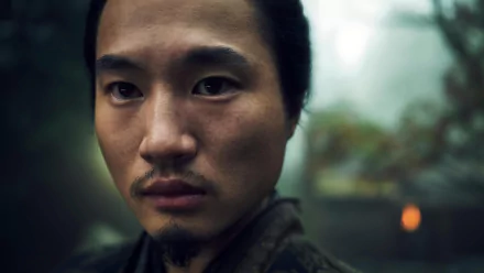 Close-up of a male character from Shogun 2024 TV show set as an HD desktop wallpaper with a blurred natural background.