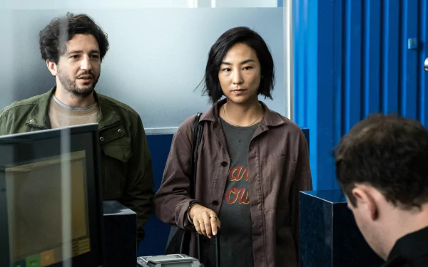 HD desktop wallpaper featuring a scene from the movie Past Lives with two characters in an indoor setting.