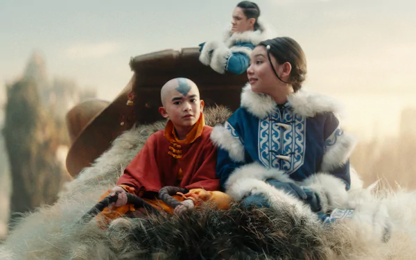 HD desktop wallpaper featuring characters Aang and Katara from the TV show Avatar: The Last Airbender, ready for an adventure with a mystical backdrop.
