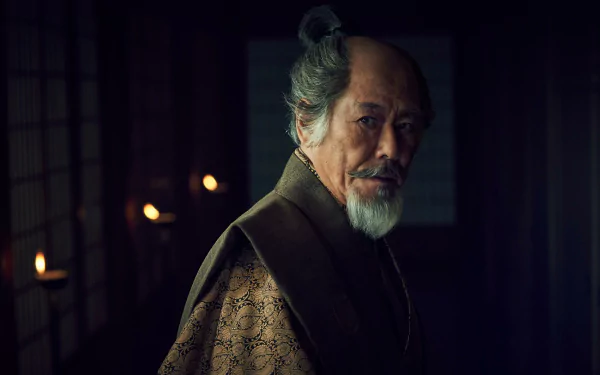 HD wallpaper featuring a character from the 2024 TV show Shogun, set against a dimly lit traditional Japanese interior.