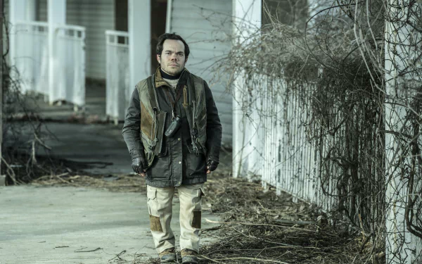 Character from The Walking Dead: The Ones Who Live standing on a desolate street in HD desktop wallpaper background.