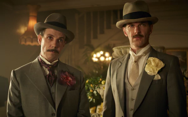 High-definition desktop wallpaper featuring two characters from the TV show Peaky Blinders dressed in early 20th-century attire.