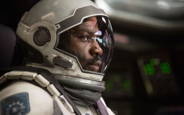 HD wallpaper of an astronaut character from the movie Interstellar, with a close-up inside a spacecraft.