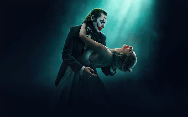 High-definition desktop wallpaper featuring a stylized representation of the Joker character from the upcoming movie Joker: Folie à Deux, highlighted by dramatic lighting in a moody atmosphere.