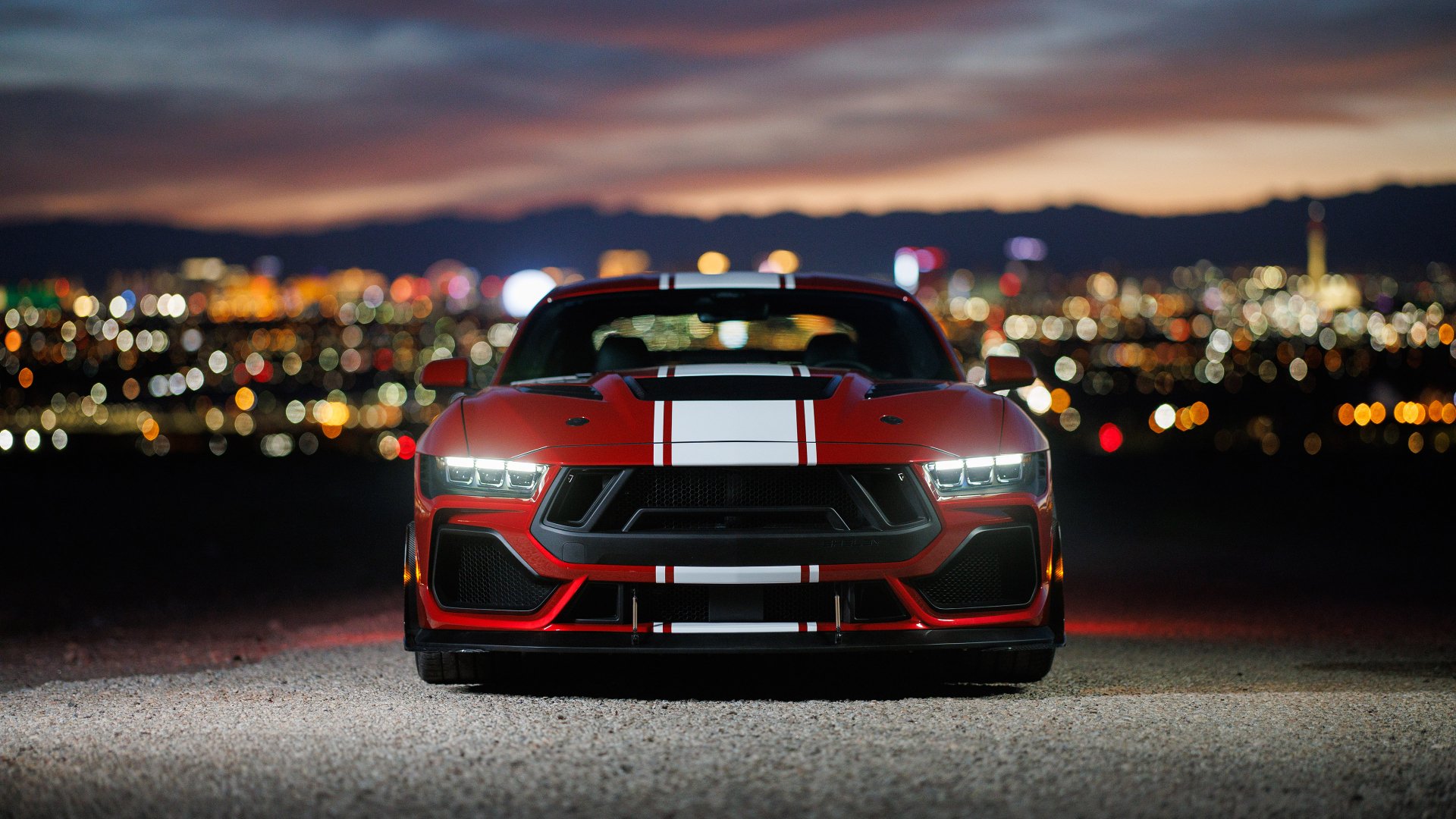 HD desktop wallpaper featuring a Shelby Super Snake muscle car, impeccably showcased against a city night skyline.
