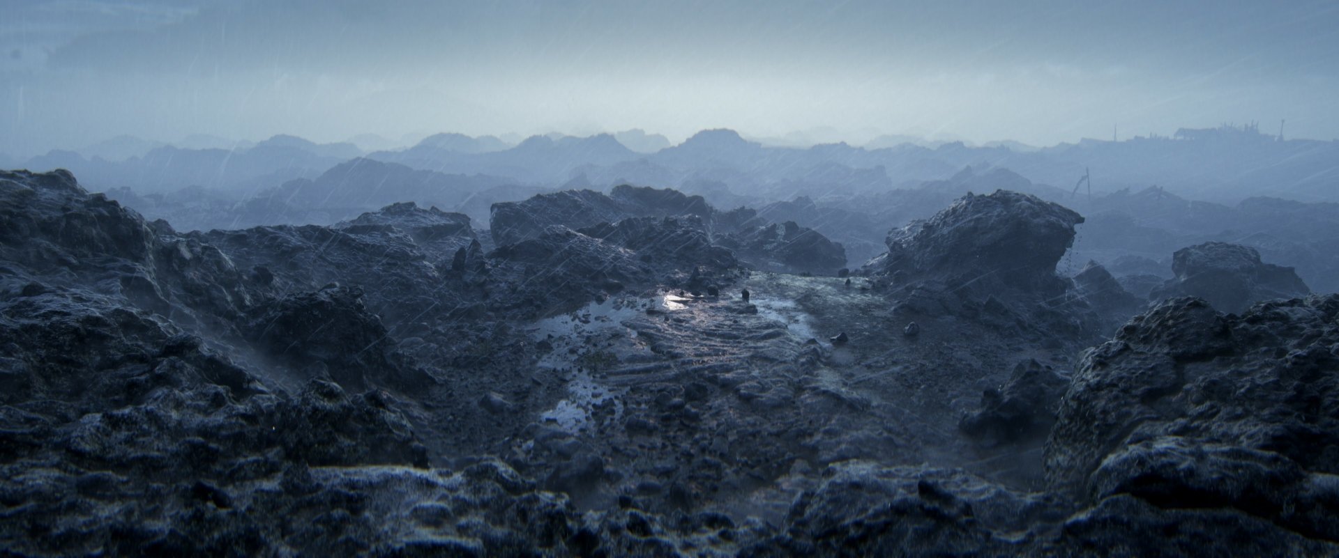 HD desktop wallpaper and background from the video game Senua's Saga: Hellblade II, featuring a desolate, rocky landscape bathed in a cold, misty atmosphere.