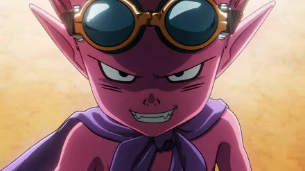 HD desktop wallpaper featuring a close-up of an animated character with purple skin, large pointed ears, sharp teeth, and goggles, set against a sandy background associated with the video game Sand Land.