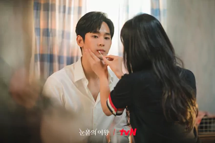 HD desktop wallpaper from the TV show Queen of Tears featuring a scene with a man being touched on the face by a woman, with tvN logo visible.