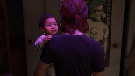 Ellie from The Last of Us Part II holds young JJ, featured in a detailed 4K Ultra HD PC wallpaper capturing a tender moment from The Last of Us series.