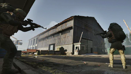 HD desktop wallpaper and background featuring two armed characters in a standoff outside a dilapidated building from the video game Arena Breakout: Infinite.