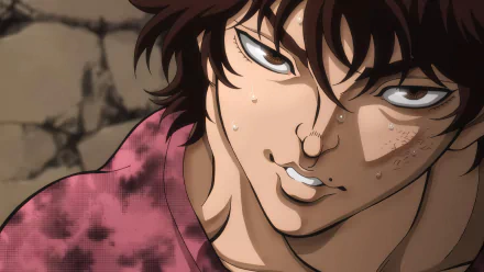 HD desktop wallpaper of Baki Hanma, the character from the anime Baki Hanma, showing a close-up of his intense expression with sweat drops and a determined look against a rocky background.