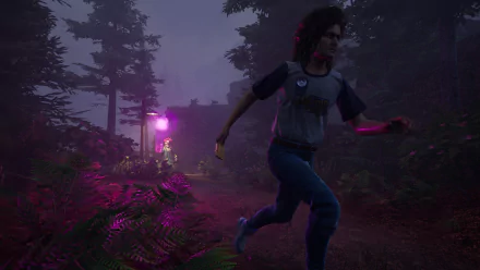 HD wallpaper from Killer Klowns from Outer Space: The Game showing a character running through a dark, eerie forest with vibrant purple lighting in the background.