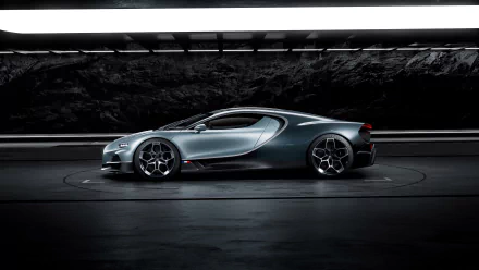 HD desktop wallpaper featuring a sleek Bugatti Tourbillon car, showcased in a modern, high-contrast setting with dark tones and dramatic lighting.
