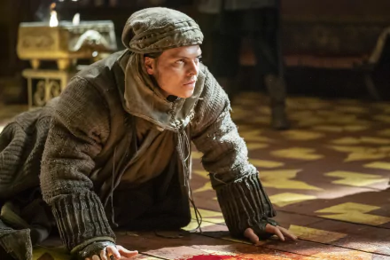 HD desktop wallpaper and background featuring Ivar the Boneless from the TV show Vikings (2013), depicted on the ground in historical attire within a dimly lit room with intricate patterns.