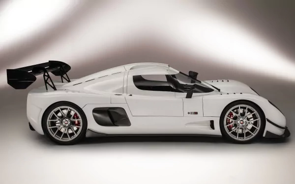 HD desktop wallpaper featuring a sleek white Ultima RS sports car on a gradient gray background.