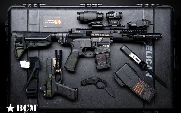 A striking HD desktop wallpaper depicting a powerful assault rifle, highlighting its military-grade design and gunmetal finish.