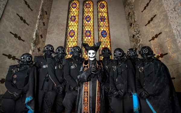 HD PC desktop wallpaper featuring Ghost B.C. with Papa Emeritus IV and the Ghouls, standing in a dimly lit, stained glass windowed church setting.