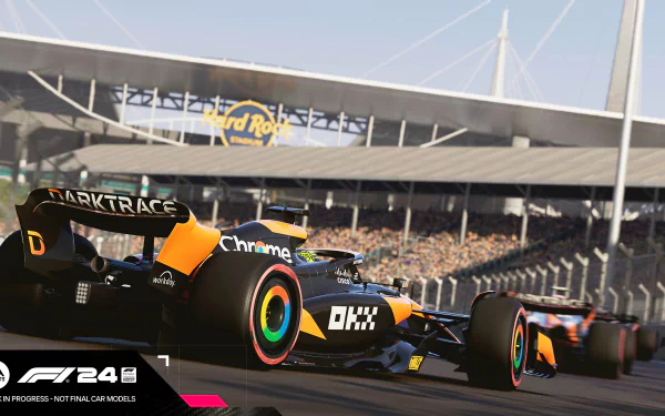 HD desktop wallpaper of F1 24 video game featuring high-speed Formula 1 cars racing on a track with a packed stadium in the background.