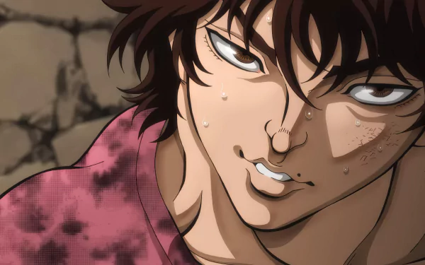 HD desktop wallpaper of Baki Hanma, the character from the anime Baki Hanma, showing a close-up of his intense expression with sweat drops and a determined look against a rocky background.