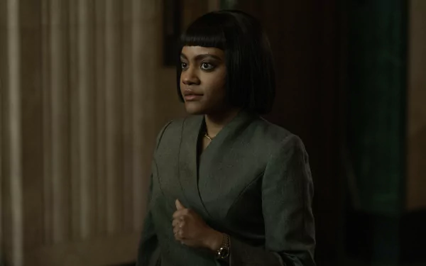 A HD desktop wallpaper featuring a character from the TV show Presumed Innocent (2024), showcasing a woman standing confidently inside a dimly lit building.