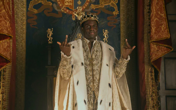 HD desktop wallpaper from the movie My Lady Jane, depicting a regal figure in ornate royal attire and crown, standing before a richly decorated throne.
