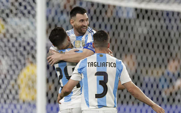 Argentina National Football Team players, including Lionel Messi, celebrate during a Copa América soccer match. (HD desktop wallpaper and background)