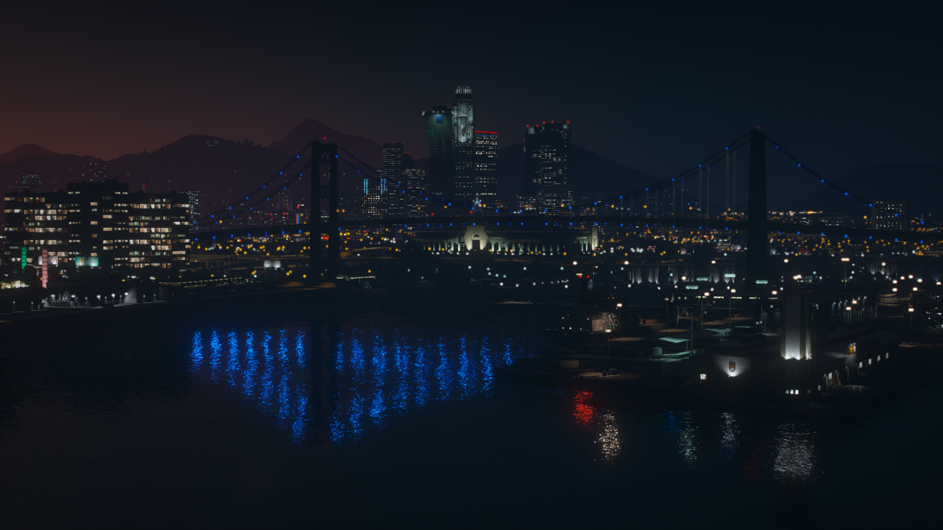 An HD desktop wallpaper featuring a vibrant cityscape from the video game Grand Theft Auto V, showcasing its detailed urban environment and dynamic atmosphere.