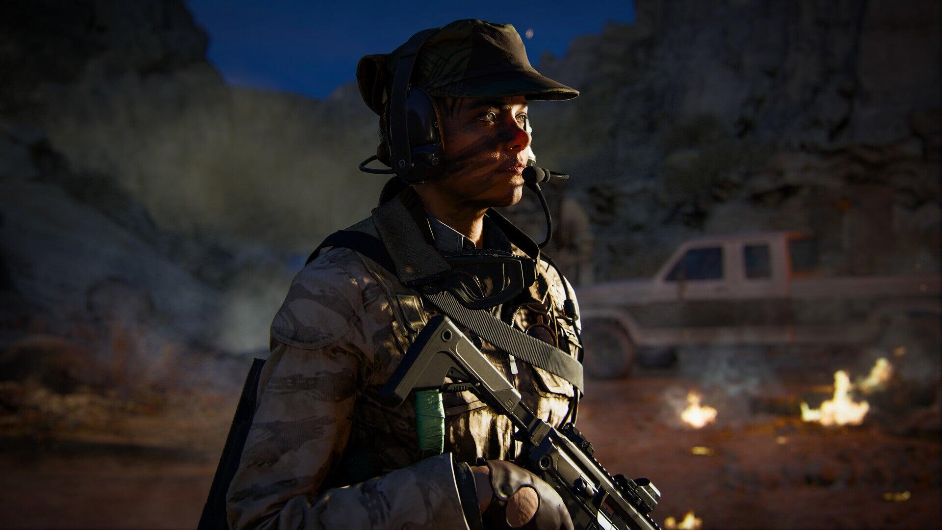 An HD desktop wallpaper featuring a character from Call of Duty: Black Ops 6, equipped with a firearm and dressed in tactical gear against a dramatic, fiery background.