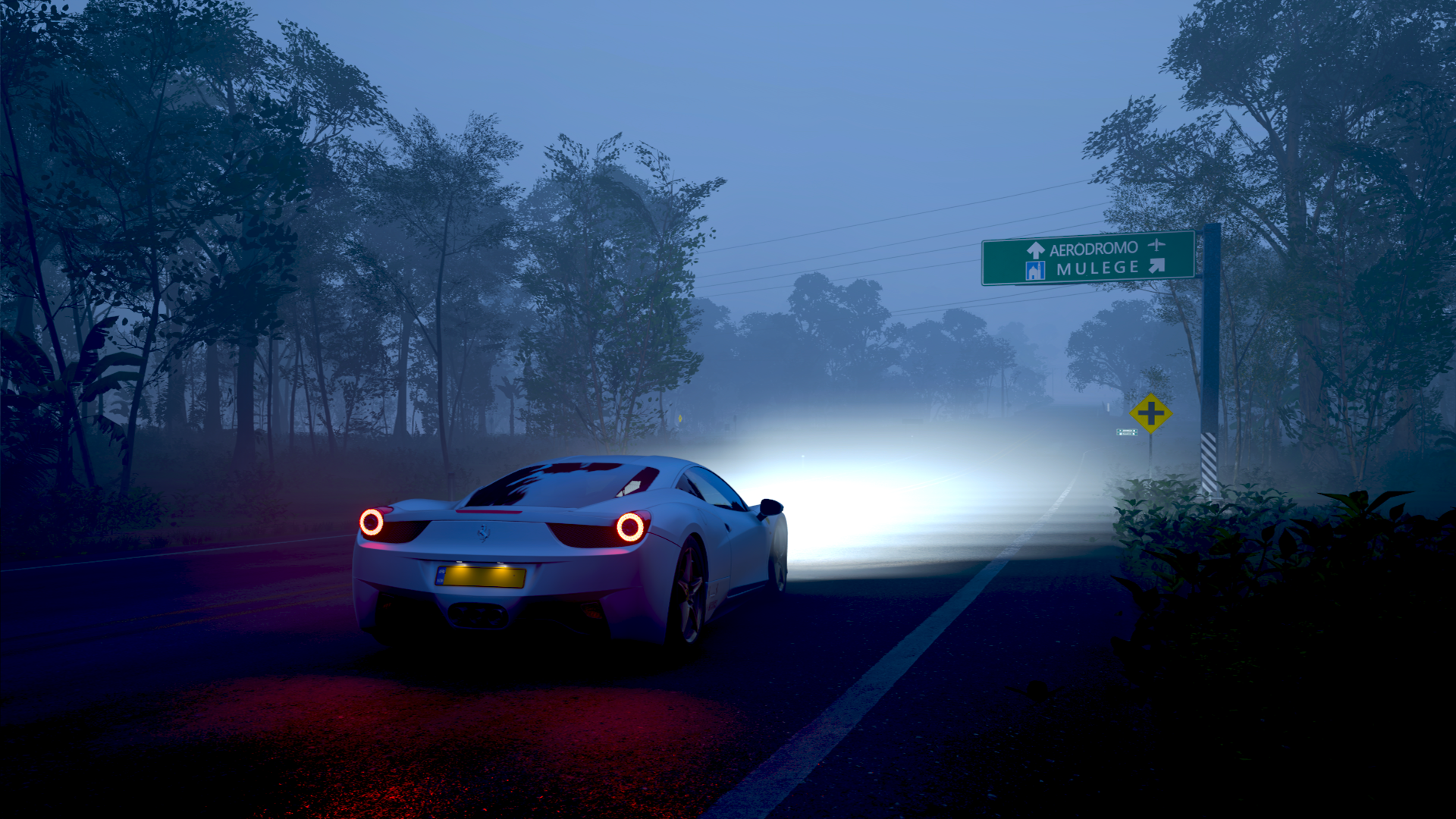 Forza Horizon 5 4K Ultra HD PC desktop wallpaper: white sports car drives down a foggy night road, headlights slicing through mist with trees and a road sign ahead.