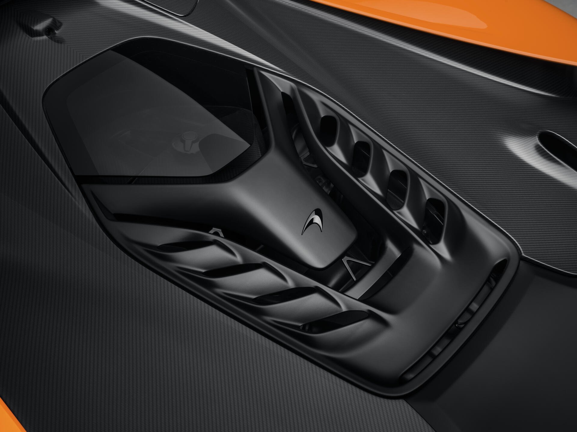 Close-up of the sleek design of a McLaren W1 vehicle, showcasing intricate details and craftsmanship in 8K Ultra HD quality for a stunning desktop wallpaper.
