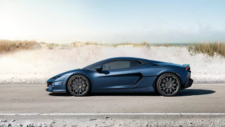 A sleek Lamborghini Temerario in vibrant blue parked on a sandy road, capturing the essence of luxury and performance in this HD desktop wallpaper.