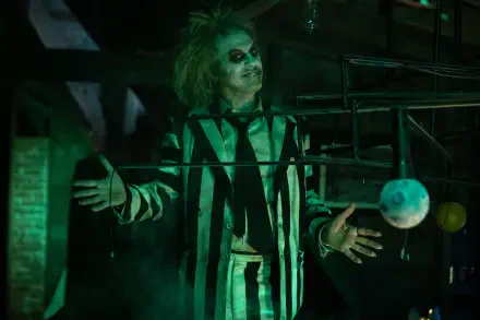 An 8K Ultra HD wallpaper featuring Michael Keaton from the classic movie Beetlejuice, capturing the film's iconic style and character.