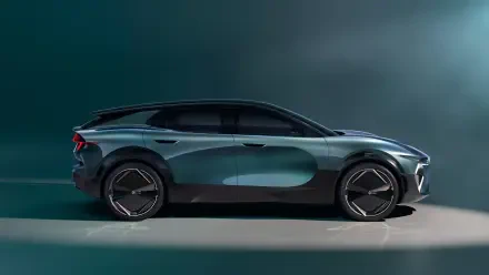 A sleek side view of a modern Renault car showcasing its distinctive design and emblem, presented as a striking 4K Ultra HD desktop wallpaper.