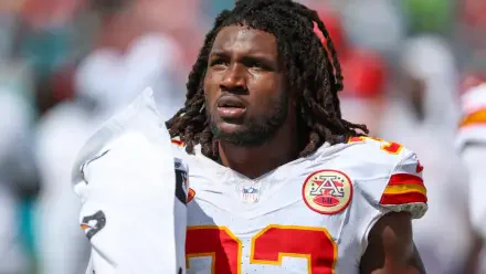 HD wallpaper featuring Kansas City Chiefs linebacker Nick Bolton on the field, capturing a moment of focus and determination during an NFL game.
