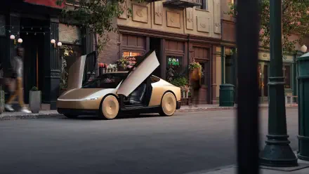 A sleek Tesla robotaxi with futuristic design is parked on a city street, showcasing its unique gullwing doors against a charming urban backdrop. 