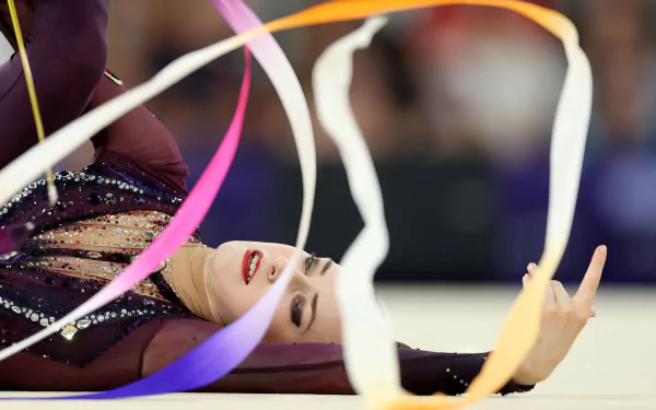 HD desktop wallpaper featuring rhythmic gymnastics at the Olympic Games Paris 2024, showcasing Germany's participation in this dynamic sport.