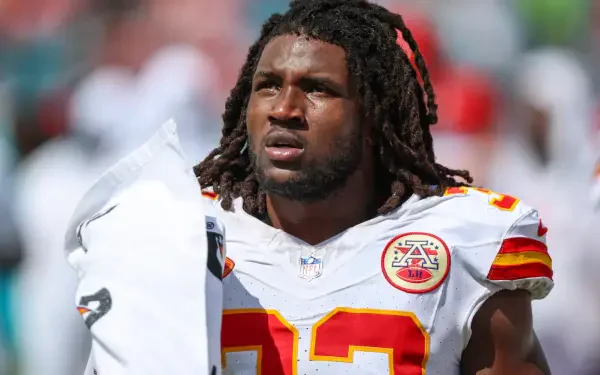 HD wallpaper featuring Kansas City Chiefs linebacker Nick Bolton on the field, capturing a moment of focus and determination during an NFL game.