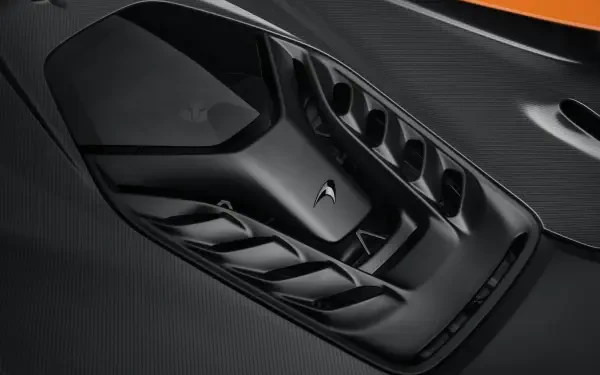 Close-up of the sleek design of a McLaren W1 vehicle, showcasing intricate details and craftsmanship in 8K Ultra HD quality for a stunning desktop wallpaper.