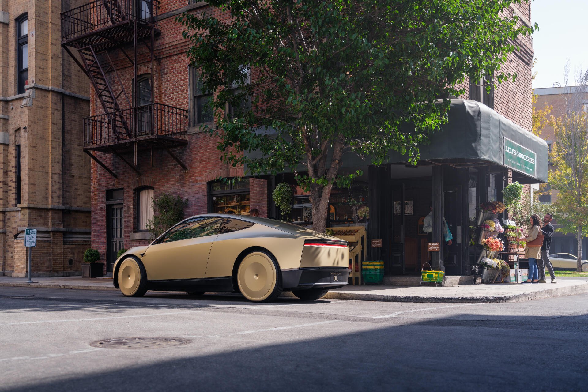 A sleek Tesla robotaxi, also known as Cybercab, is parked on a city street near a shop, surrounded by greenery and urban architecture, showcasing advanced automotive design.