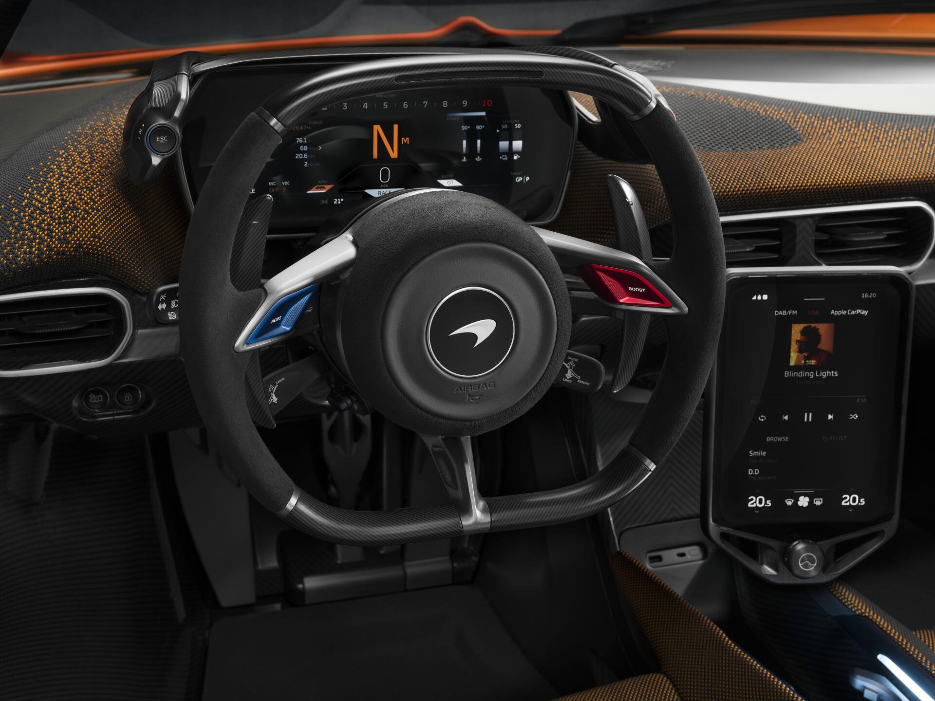Detailed interior view of a McLaren W1, showcasing the sleek steering wheel and advanced digital display. An 8K Ultra HD desktop wallpaper highlighting automotive design.