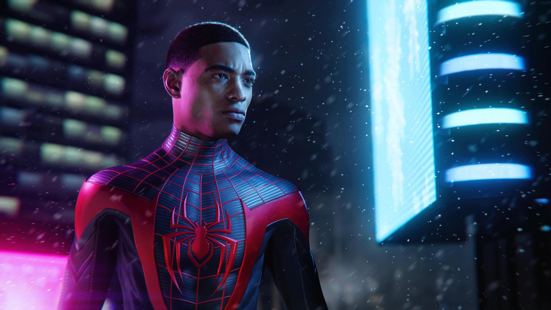 A 4K Ultra HD PC wallpaper featuring Miles Morales from Marvel's Spider-Man, standing in a rain-soaked cityscape with neon lights illuminating the scene.