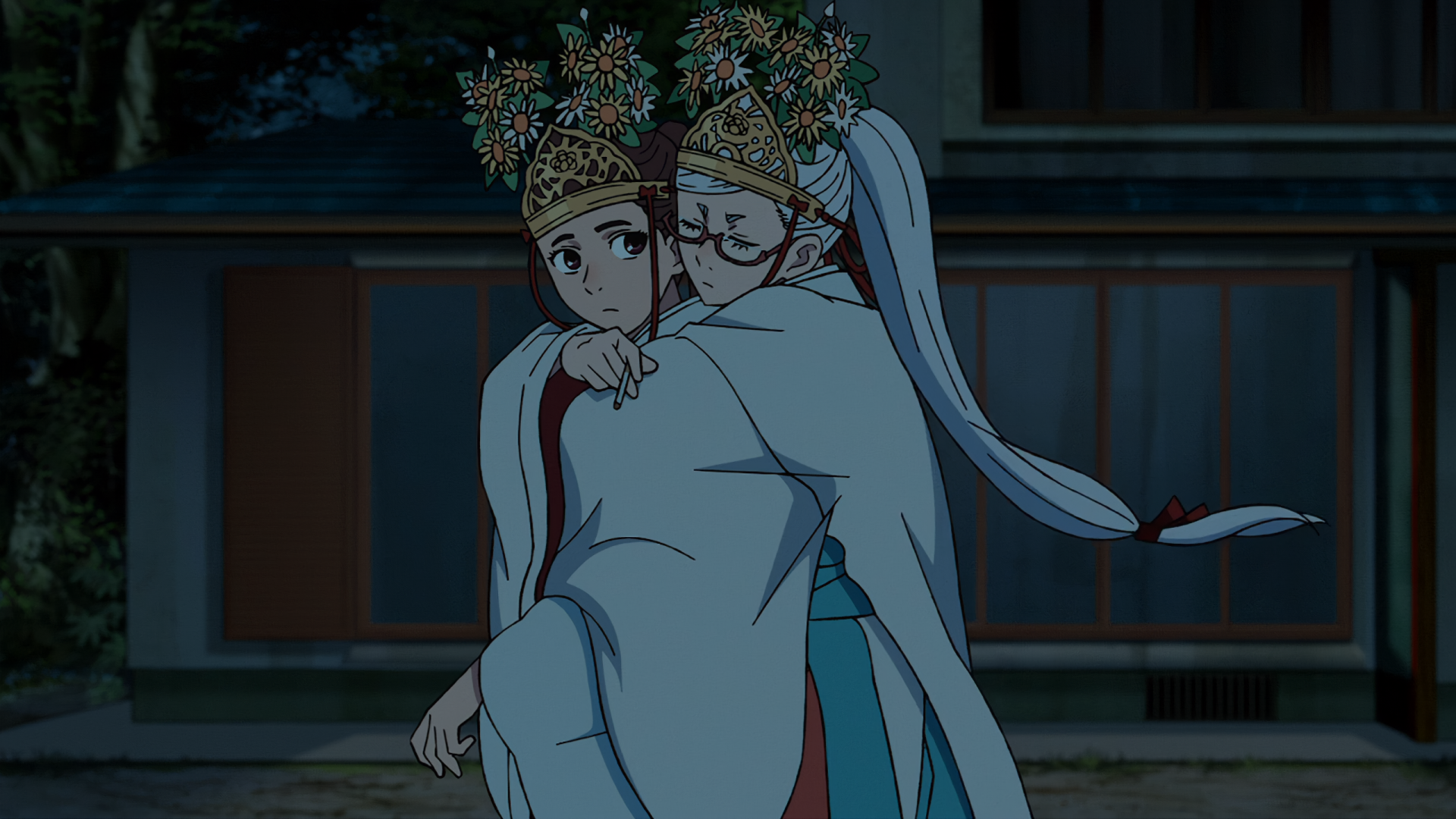 An HD desktop wallpaper featuring characters Momo Ayase and Seiko Ayase from the anime Dandadan, adorned with floral crowns, captured in a serene outdoor setting.