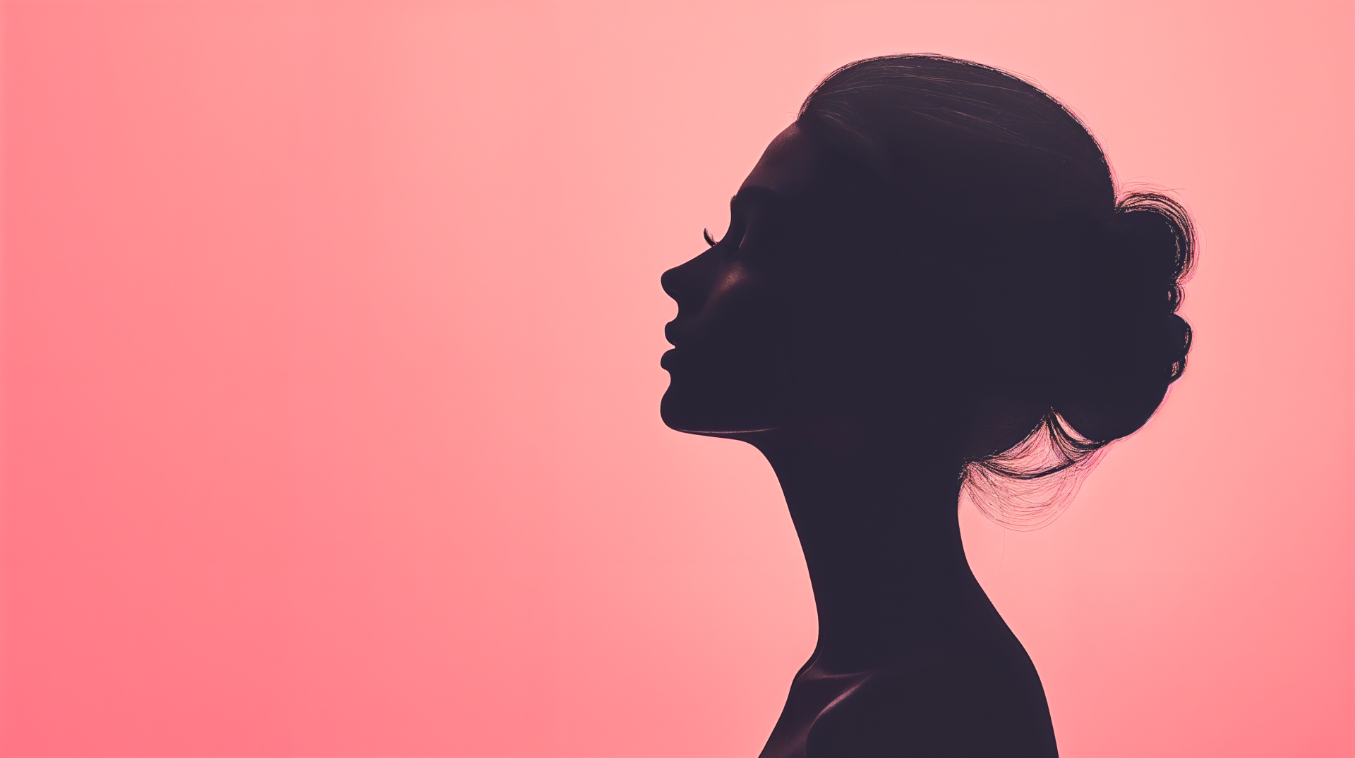 A feminine silhouette of a woman against a soft pink background, featured as a striking 4K Ultra HD PC desktop wallpaper and background.