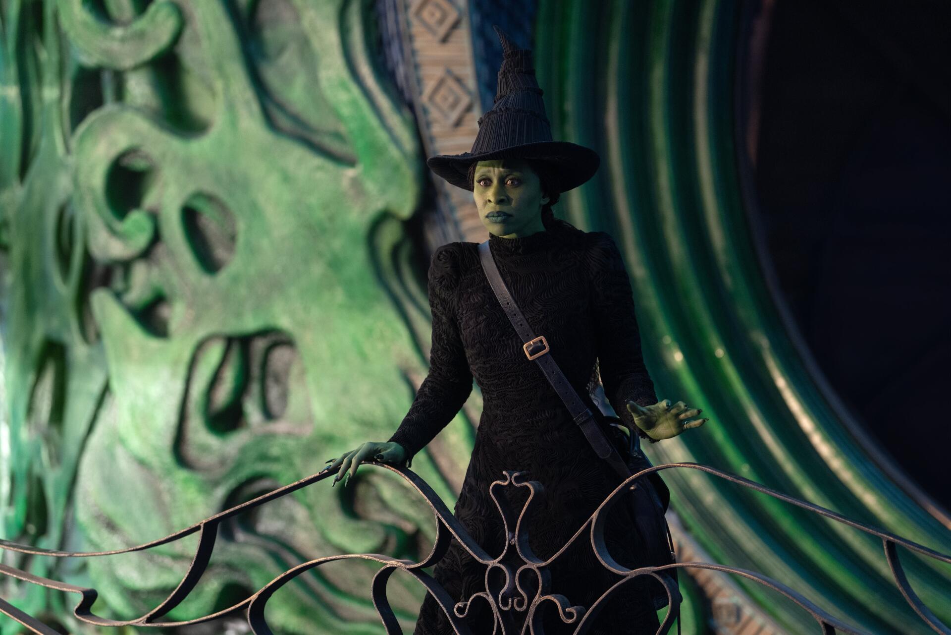 A striking 4K Ultra HD wallpaper featuring Cynthia Erivo as Elphaba from the movie Wicked, showcasing her iconic green makeup and witch attire against a vibrant backdrop.