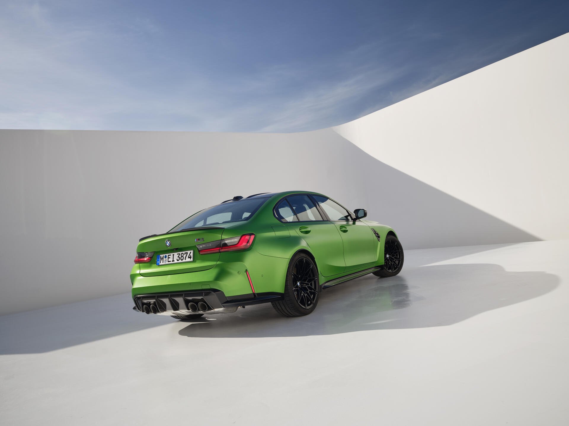 A vibrant green BMW M3 is showcased in this 4K Ultra HD desktop wallpaper, featuring a sleek design with stylish black accents against a minimalist backdrop.