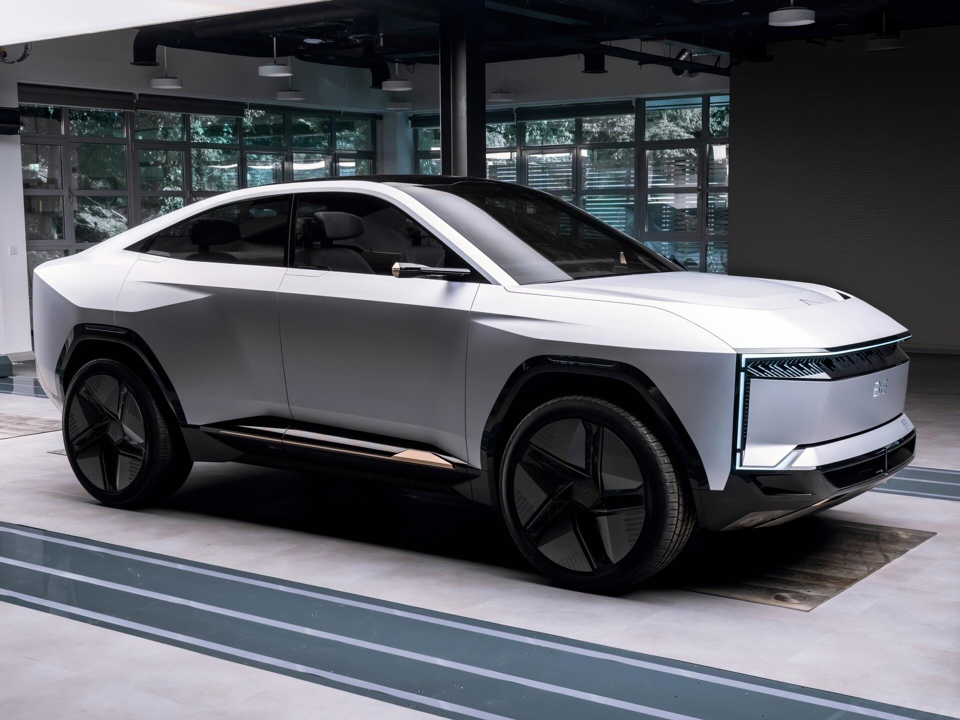 HD PC desktop wallpaper featuring the Mahindra BE 09, a sleek white electric vehicle showcasing modern design and advanced automotive technology.